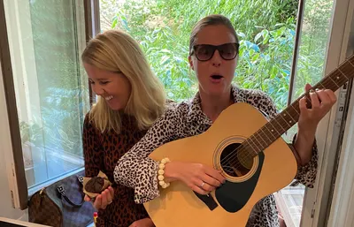 Jenny playing Wonderwall on the office guitar